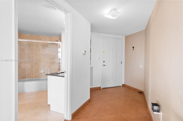 corridor featuring light tile patterned flooring