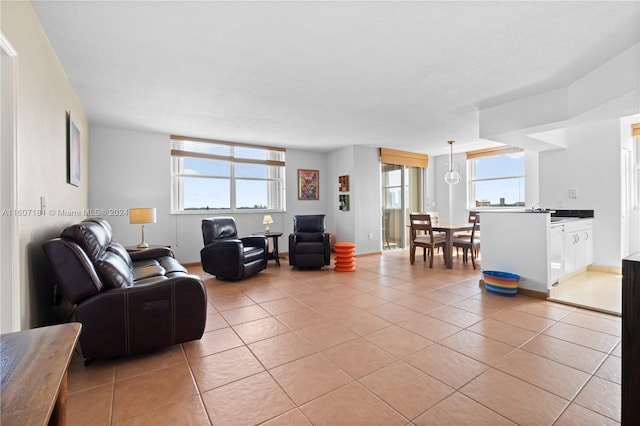 tiled living room featuring a wealth of natural light