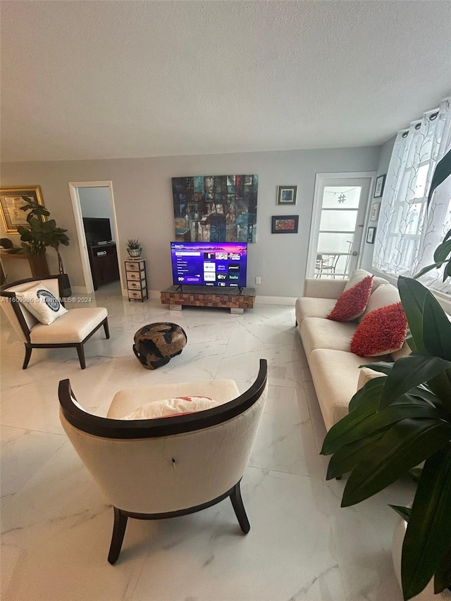 living room with a textured ceiling