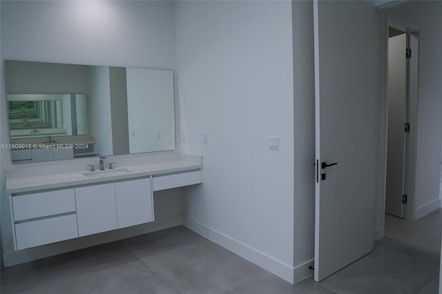 bathroom featuring vanity and concrete floors