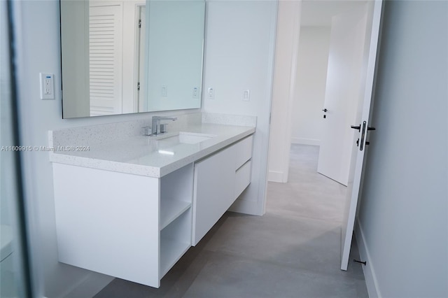 bathroom with vanity and concrete floors