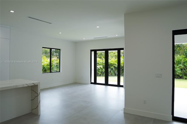 spare room featuring a wealth of natural light