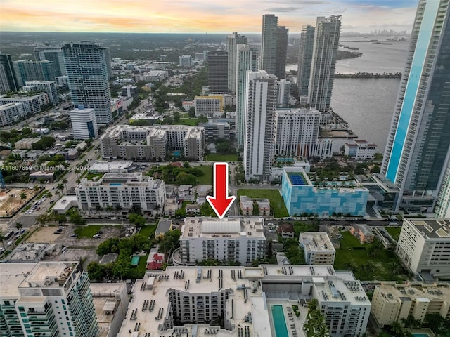 aerial view at dusk with a water view