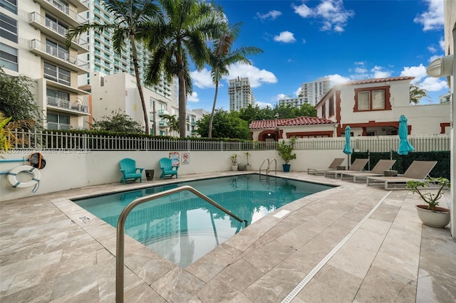 view of pool featuring a patio area