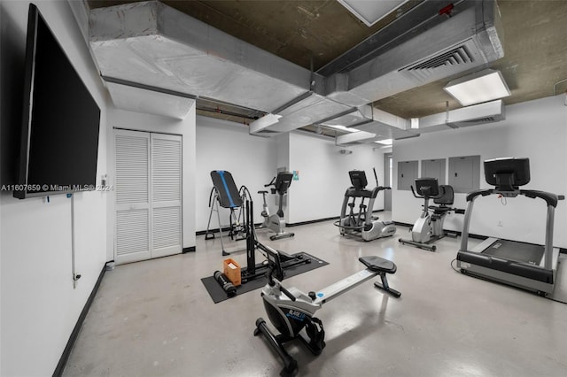 workout area featuring concrete flooring