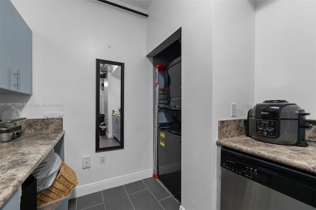 kitchen with dishwasher and dark tile floors