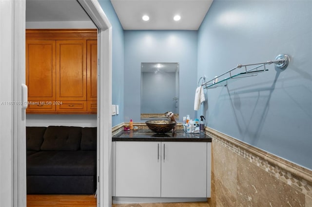 interior space featuring hardwood / wood-style flooring and vanity