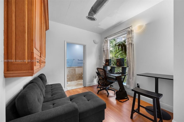 office area with light hardwood / wood-style flooring