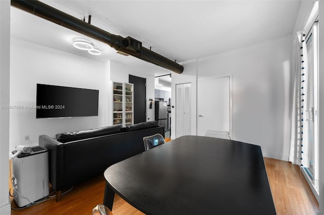 dining room with hardwood / wood-style flooring