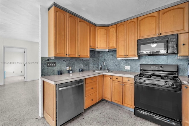 kitchen with tasteful backsplash, sink, and black appliances