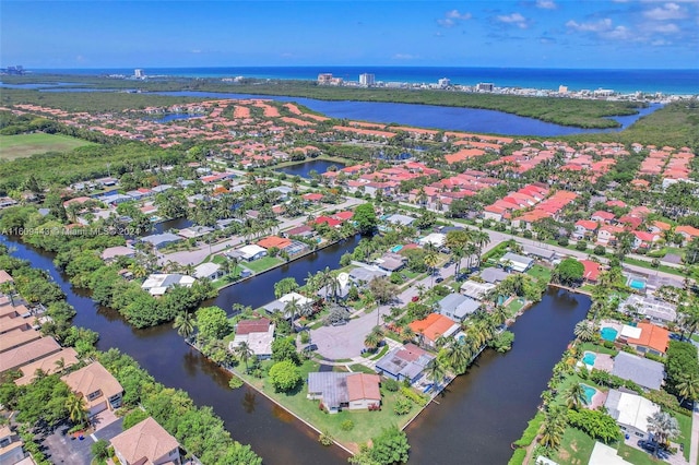 birds eye view of property featuring a water view