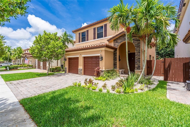 674 SE 33rd Ter, Homestead, FL 33033 - mediterranean / spanish-style house featuring a garage and a front lawn