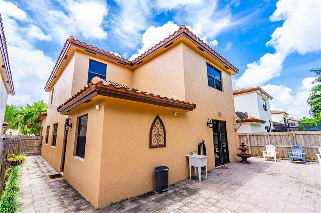 back of house featuring a patio