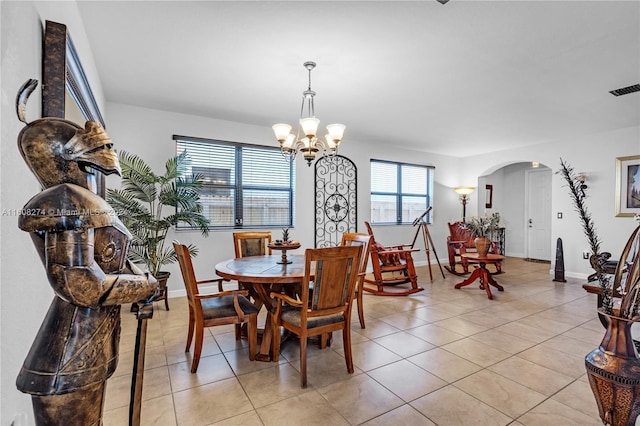 674 SE 33rd Ter, Homestead, FL 33033 - tiled dining area with an inviting chandelier