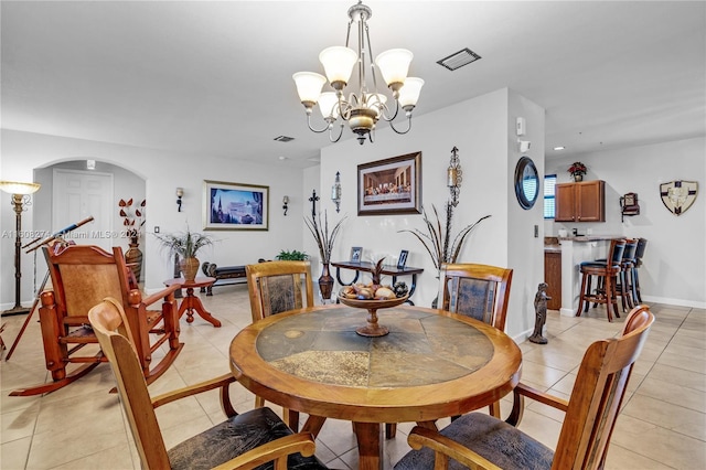 674 SE 33rd Ter, Homestead, FL 33033 - tiled dining area with an inviting chandelier