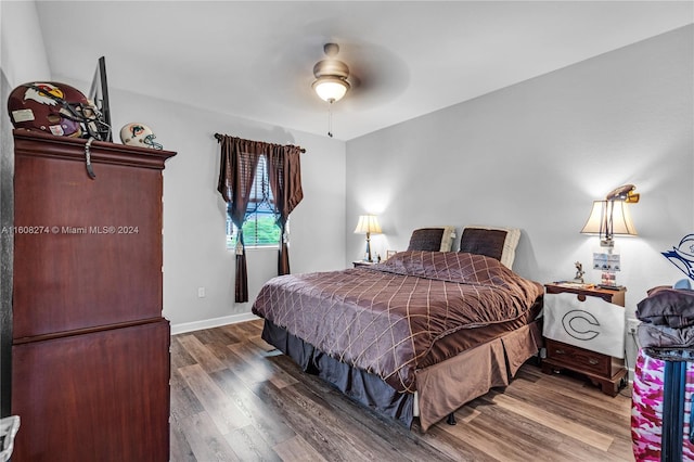 bedroom with hardwood / wood-style flooring and ceiling fan