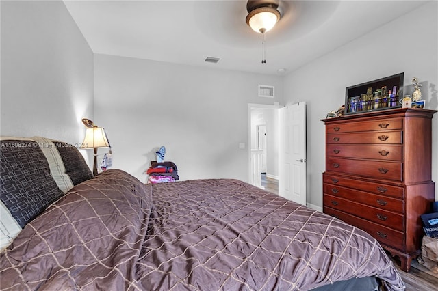 bedroom with hardwood / wood-style flooring and ceiling fan