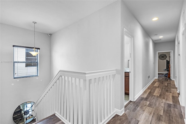 corridor featuring dark hardwood / wood-style floors