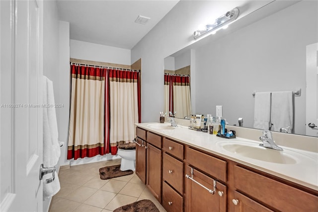 bathroom featuring oversized vanity, double sink, toilet, and tile floors