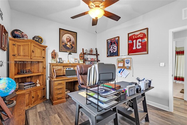 office featuring wood-type flooring and ceiling fan