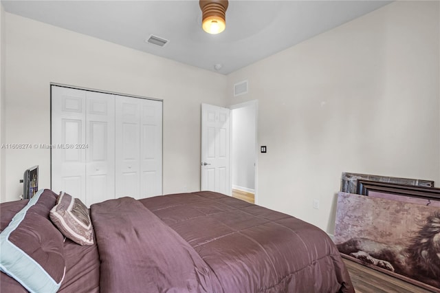 bedroom featuring a closet and hardwood / wood-style flooring