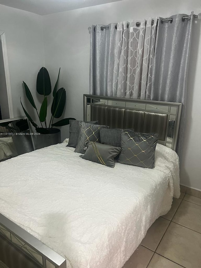 bedroom featuring tile patterned floors