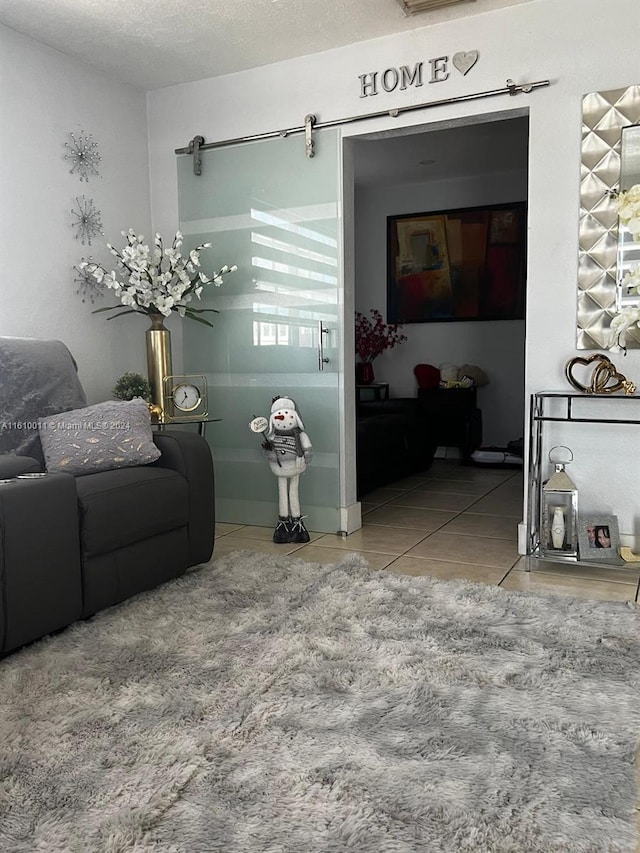 living room with a textured ceiling and tile patterned floors