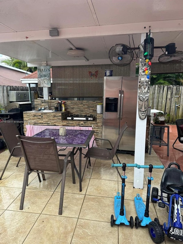 view of patio / terrace featuring fence