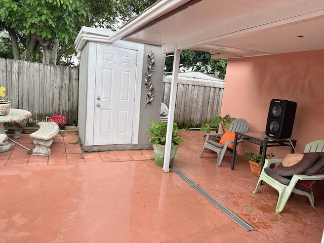 view of patio / terrace featuring fence