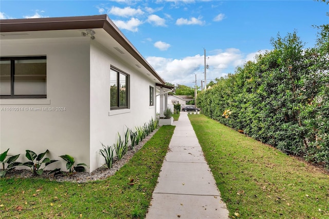 view of home's exterior featuring a lawn