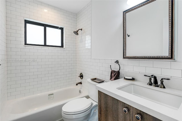 full bathroom with decorative backsplash, vanity, tiled shower / bath combo, tile walls, and toilet