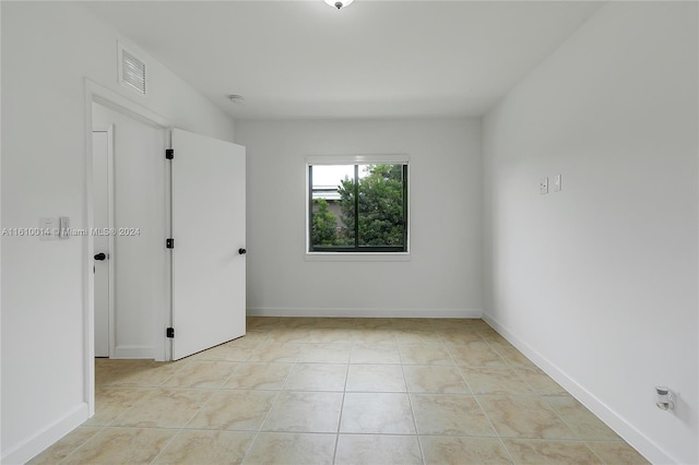 view of tiled spare room