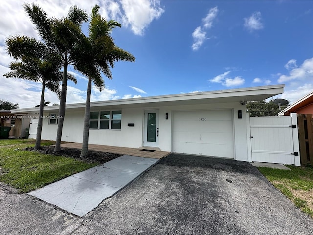 single story home with a garage