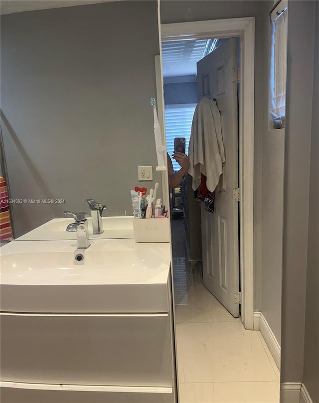 bathroom with tile patterned flooring and vanity