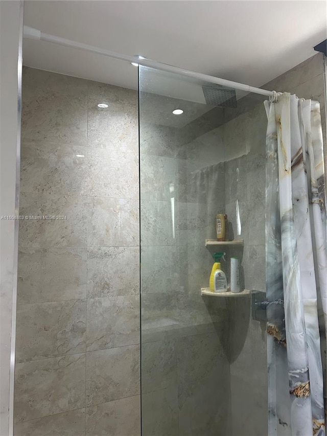 bathroom with a shower with shower curtain