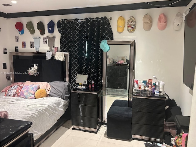 bedroom featuring light tile patterned flooring