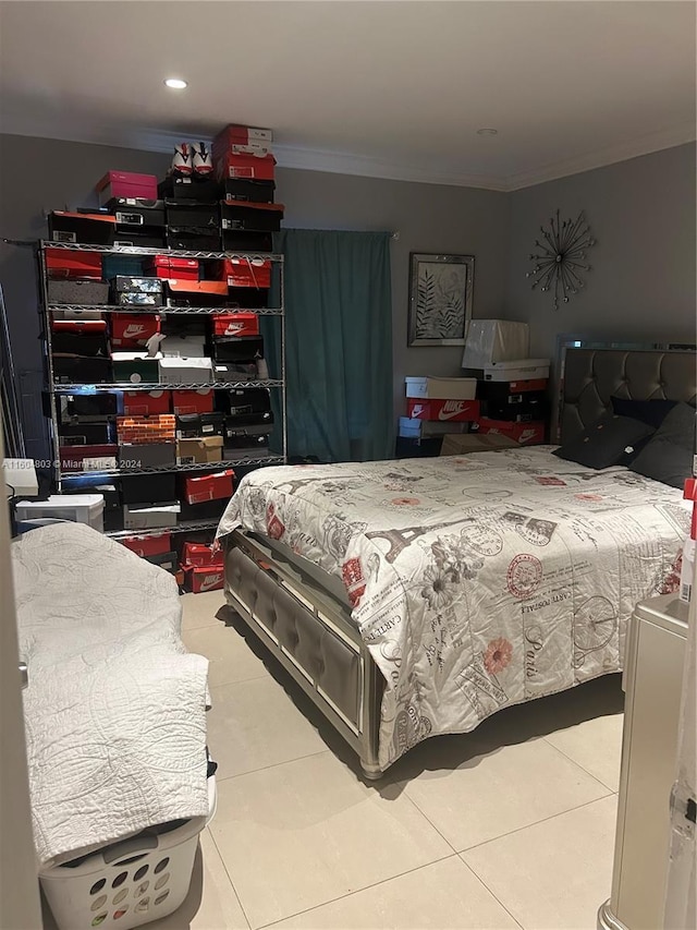 bedroom with tile patterned flooring and ornamental molding