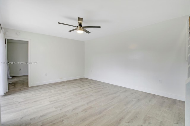 empty room with light hardwood / wood-style flooring and ceiling fan