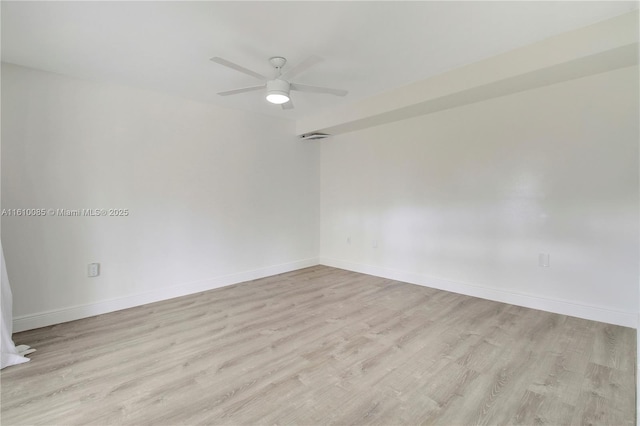 empty room featuring ceiling fan and light hardwood / wood-style floors