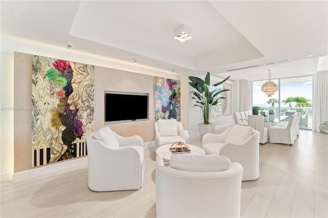 living room with a tray ceiling