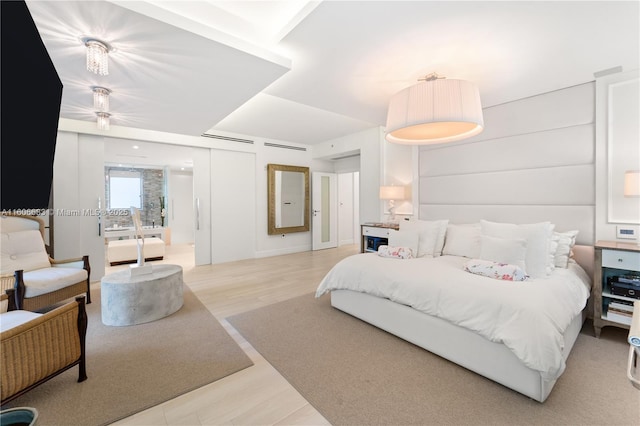 bedroom featuring light hardwood / wood-style flooring