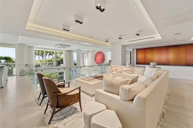 community lobby featuring a raised ceiling