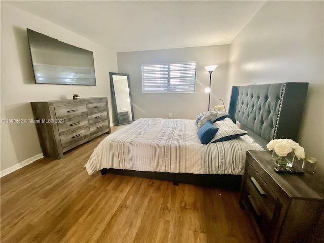 bedroom featuring hardwood / wood-style floors