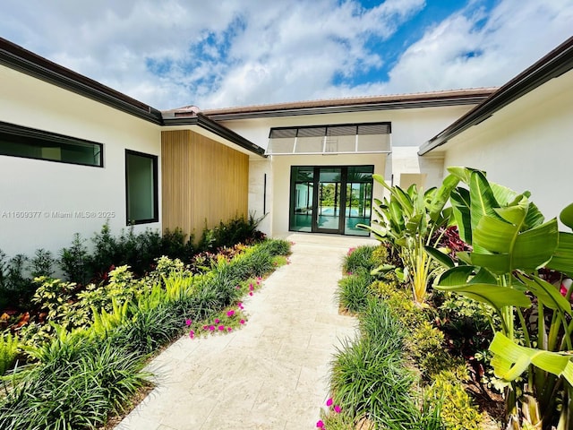 12231 SW 2nd St, Plantation, FL 33325 - doorway to property with stucco siding