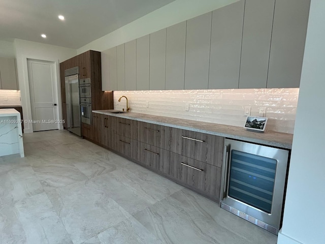 12231 SW 2nd St, Plantation, FL 33325 - kitchen featuring wine cooler, modern cabinets, built in refrigerator, a sink, and recessed lighting