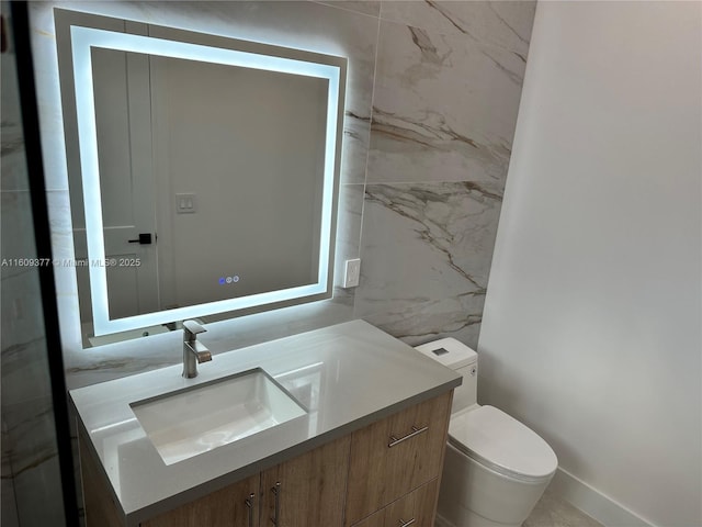 bathroom with vanity and toilet