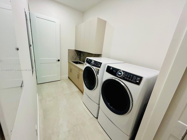 12231 SW 2nd St, Plantation, FL 33325 - laundry room featuring washing machine and clothes dryer, cabinet space, and light tile patterned floors