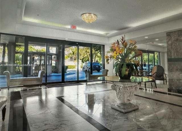 800 NE 195th St Unit 619, Miami, FL 33179 - community lobby with a textured ceiling