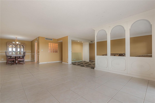 800 NE 195th St Unit 619, Miami, FL 33179 - unfurnished living room with light tile patterned floors, a chandelier, and baseboards