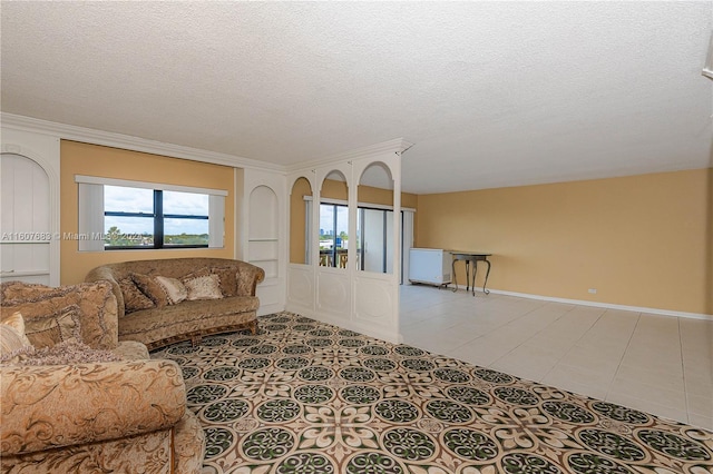 living room featuring crown molding, a textured ceiling, and light tile patterned floors